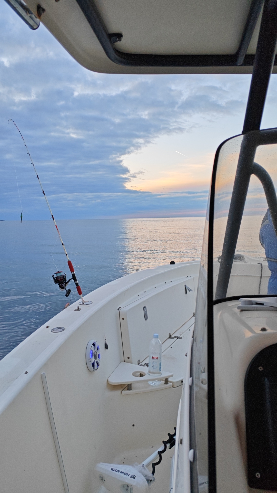 Sunrise on the bow of the Pursuit, lines in the water